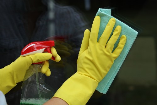 Professional sofa cleaning service in Swiss Cottage refreshing a fabric sofa