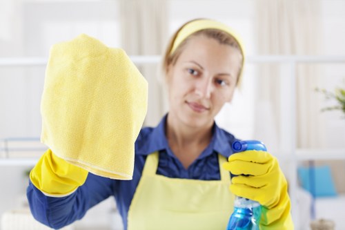 Carpet cleaning technician preparing equipment with safety measures in place